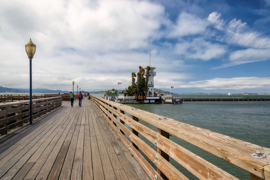 Wooden pier with a beacon in the San Francisco gulf.
