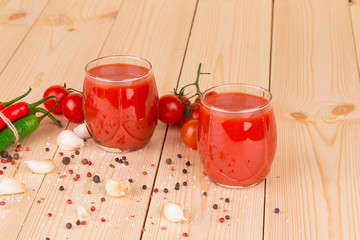 Tomato juice on the wooden desk