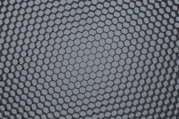 Honeycomb grid against grey background
