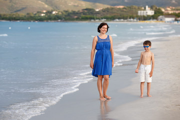 Mother and son on tropical beach
