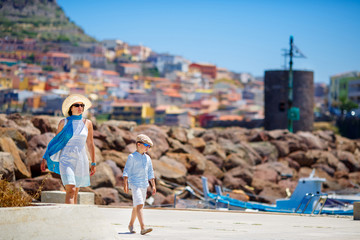 Mother and her little son outdoors in city