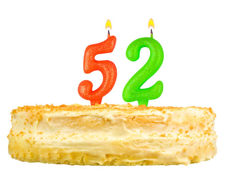 birthday cake with candles number fifty two isolated on white