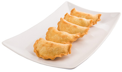 Popular traditional Malaysian snack curry puff on a white plate