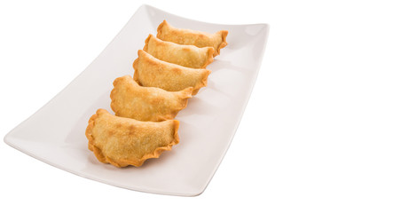 Popular traditional Malaysian snack curry puff on a white plate