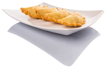 Popular traditional Malaysian snack curry puff on a white plate