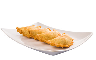 Popular traditional Malaysian snack curry puff on a white plate
