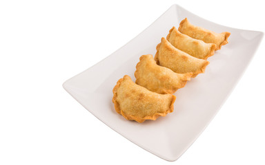Popular traditional Malaysian snack curry puff on a white plate