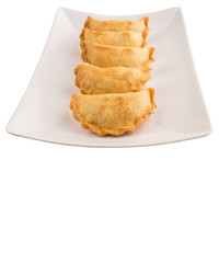 Popular traditional Malaysian snack curry puff on a white plate