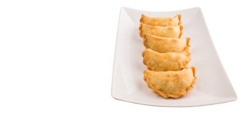 Popular traditional Malaysian snack curry puff on a white plate