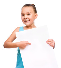 Little girl is holding blank banner