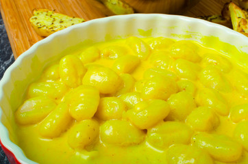 Curry gnocchi with bhajjis and roasted potato