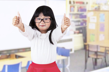 Adorable girl in kindergarten class