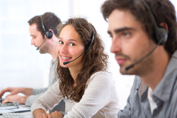 Young attractive woman working in a call center