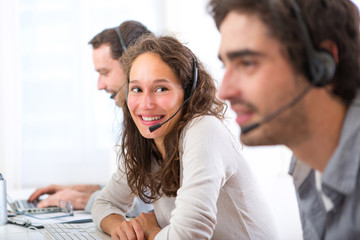 Young attractive woman working in a call center