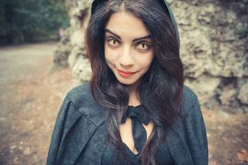 beautiful dark vampire woman with black mantle and hood