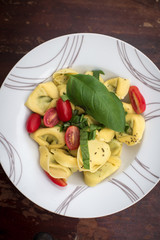 Ravioli with tomatos and basil