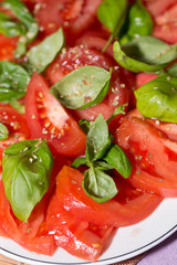 sliced of  tomatoes with basil,