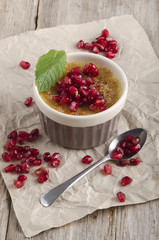 creme brulee with pomegranate seed