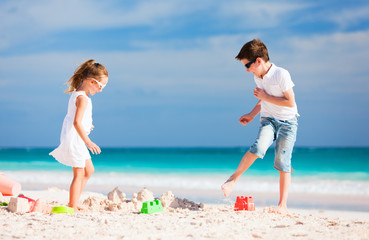 Two kids playing at beach