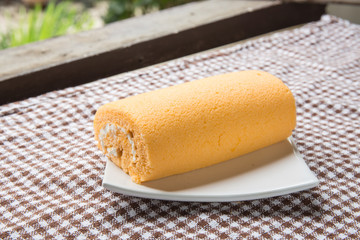 split cream cake on dish