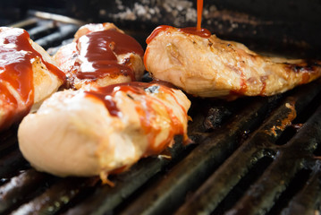 barbeque chicken cooking on the grill