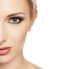 half face of beautiful blond on white background