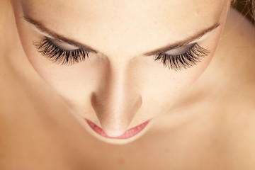 Naklejka premium female face and eyes with false eyelashes
