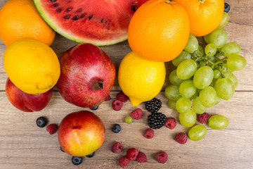 Watermelon, Pomegranate, Oranges, Lemons, Grapes And Berries