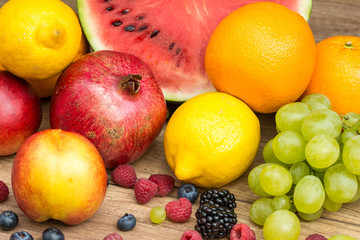 Watermelon, Pomegranate, Oranges, Lemons, Grapes And Berries