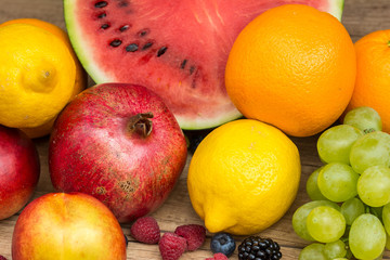 Watermelon, Pomegranate, Oranges, Lemons, Grapes And Berries