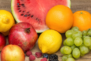 Watermelon, Pomegranate, Oranges, Lemons, Grapes And Berries