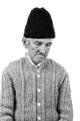 Portrait of a sad peasant deep in thoughts