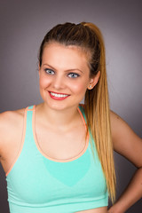 Fototapeta premium Closeup portrait of a beautiful blonde woman with sporty wear