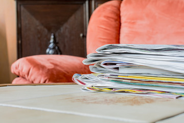 Stack Of Newspapers On A Tile-Table