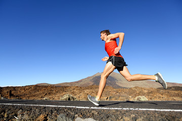 Sport running man - male runner training outdoors