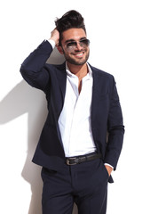Handsome business man fixing his hair