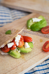 Pita bread with avocado, tomatoes and feta