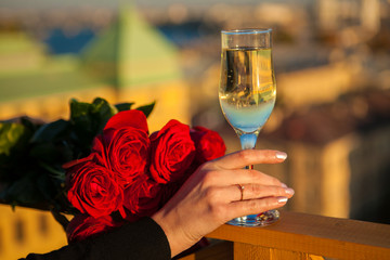 A glass of champagne in hand, romance