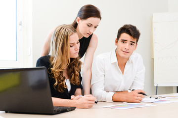 young people business team working together in a meeting room