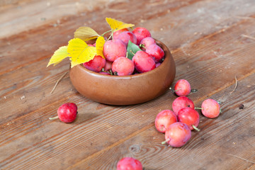 Crab apples in a wooden bowl