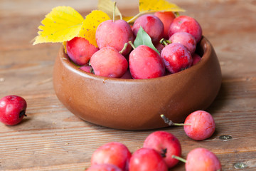 Crab apples in a wooden bowl