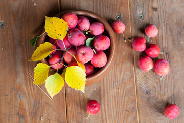 Crab apples in a wooden bowl