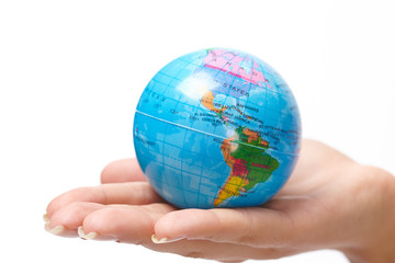 woman's hand with globe