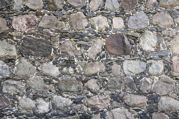 Ancient gray stone wall, background photo texture