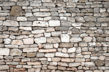 Ancient gray stone wall, background photo texture