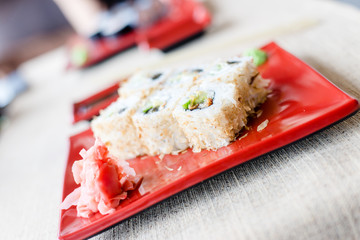 sushi plate on white tablecloth background
