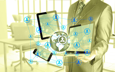 Business man using tablet PC and smartphone social connection