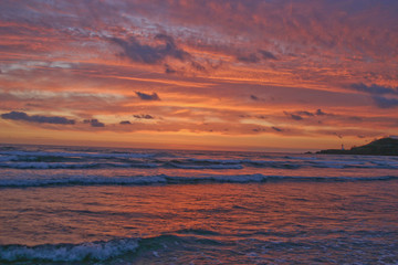 Fototapeta premium Brilliant Pacific Sunset and Lighthouse