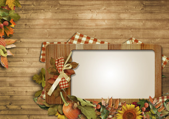 Autumn leaves,pumpkins,frame on a wooden background © VV