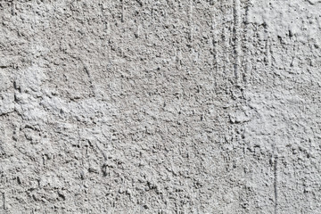 Light gray concrete wall with stucco. Background texture
